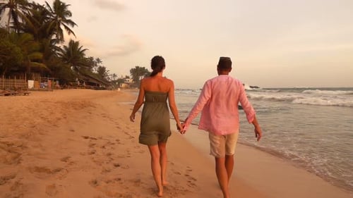 Couple Holding Hands and Running on Beach During Sunset, Super
