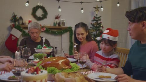 Family Celebrates Christmas Holiday Dinner Together