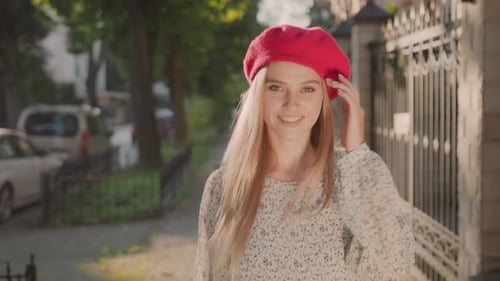 Stylish Woman Walks Down Sunny City Street