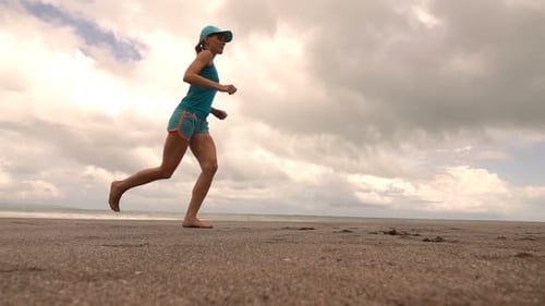 Woman Jogging On Beach, Super Slow Motion 240fps