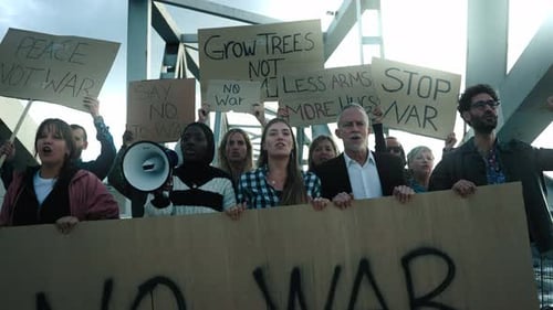 Group Protests Against War Under Metal Structure