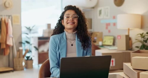 Smiling Woman Works at Computer in Bright Office