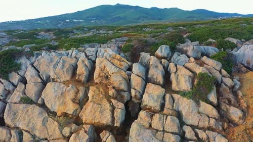 Drone Flying Over Dramatic Rugged Rock Cliff