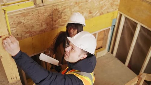 Home Inspector Teamwork on Construction Site