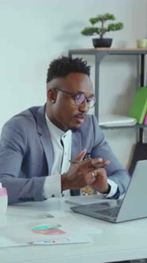 Young Adult Man Working from Home Office