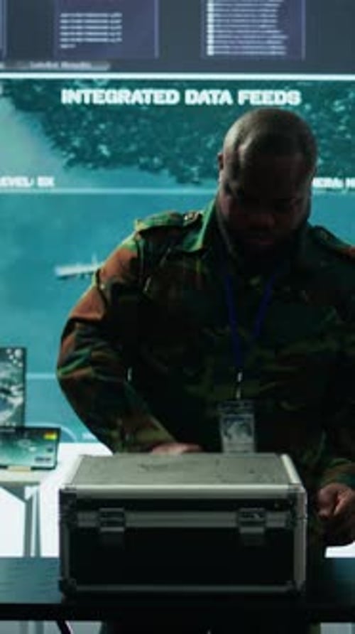 Vertical Video Military Expert in a Control Center Uses Advanced Technology and Modern Gear