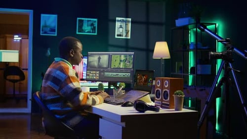 Young Adult Working at Computer in Modern Room