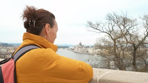 Woman Enjoying Scenic Cityscape View from Vantage Point
