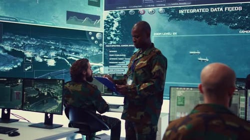Military Personnel Analyzing Data in Tech Command Center
