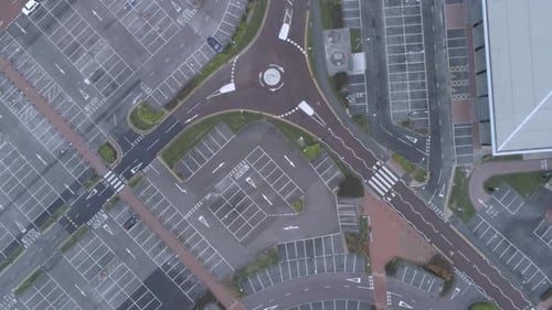 Aerial view above empty quarantine corona virus outbreak shopping retail car park markings moving do