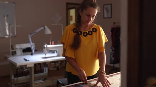 Fashion Designer Woman Working in Studio Caucasian Female Tailor Drawing the Layout for Clothes on