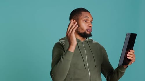 Man Talking on Tablet Video Call