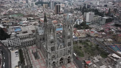 Aerial tilt down above del voto national basilica in Quito, Ecuador
