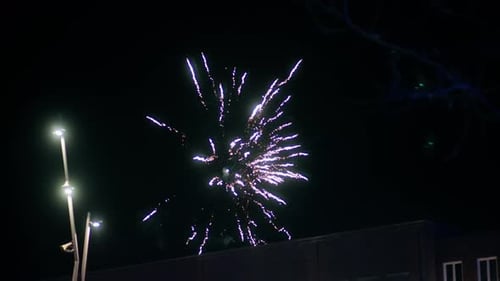 4K New year's eve fireworks celebration fireworks background. shining fireworks bokeh lights in the