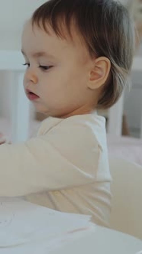 Delightful Infant Drawing at Table Indoors