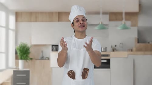 Chef Presenting in Bright, Modern Kitchen Setting