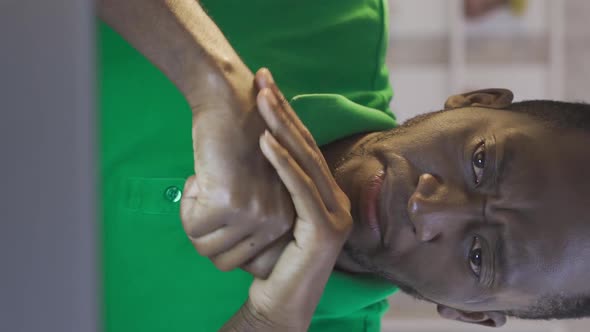 Vertical Video of Frustrated young black man becomes desperate and ...
