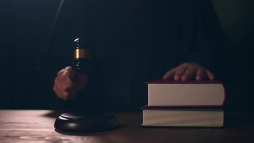 Close up of Judge hand is hitting hammer judge in courtroom