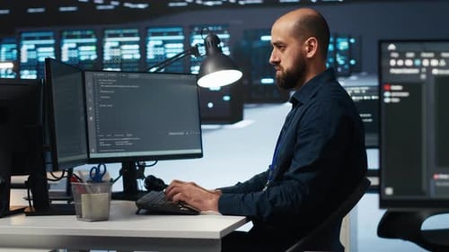 IT Specialist in Server Farm Ensuring Valuable Data Remains Shielded