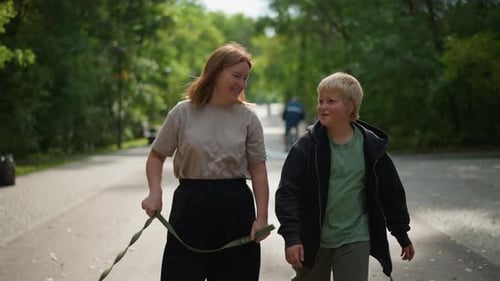 Child And Woman Stroll Female And Boy Walk Pet Lady And Young Boy Enjoy Leisurely Walk Woman With