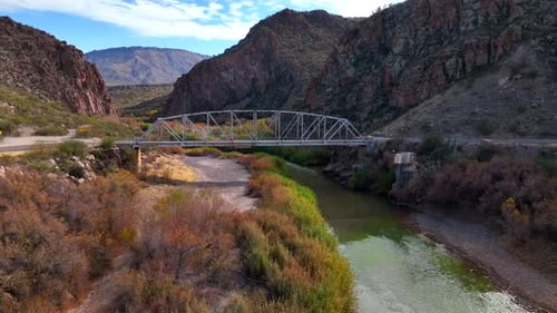 Aerial view of Salt River with bridge and mountains, United States.