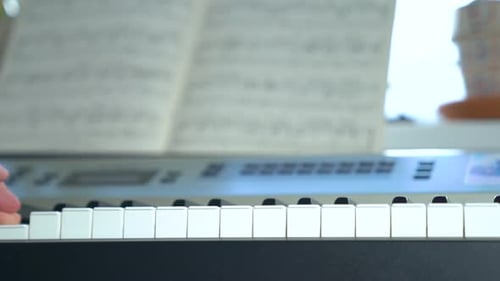 Hand Plays Piano Keyboard Up Close
