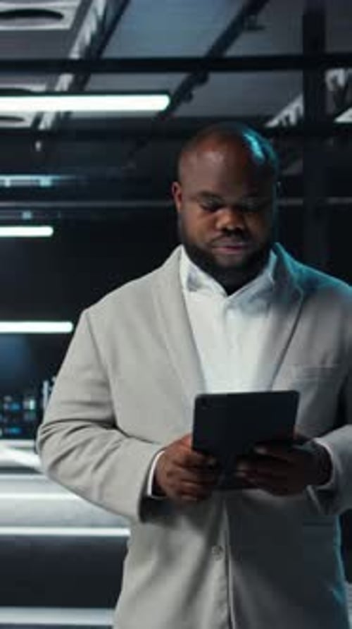 Professional at Work Using Digital Tablet in Office