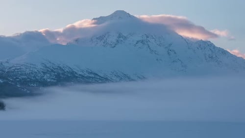 Moving cloudy over snow mountains time-lapse