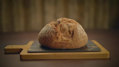 Rustic Loaf of Bread on Cutting Board