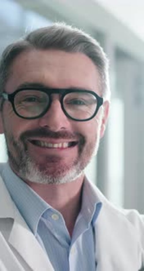 Hospital, doctor and face of mature man for medical service, confidence and healthcare career