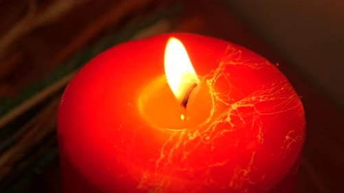 Color Candles Slowly Burning Down in Dark
