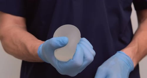 Close Up of Breast Implant Being Held