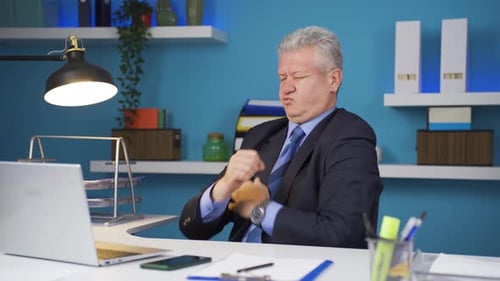 Businessman Experiences Shoulder Pain at His Desk