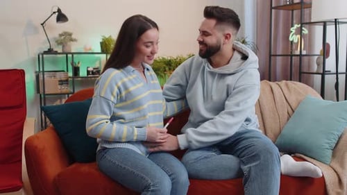 Loving Couple Excited About Positive Pregnancy Test Result
