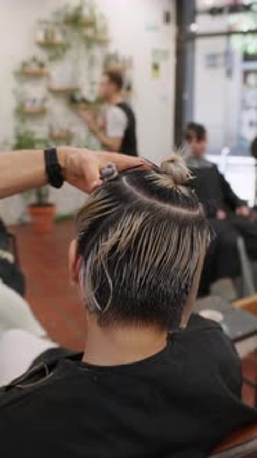 Barber Styling Hair at Salon