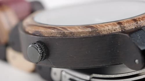 Close up of a rotating watch made from wood.