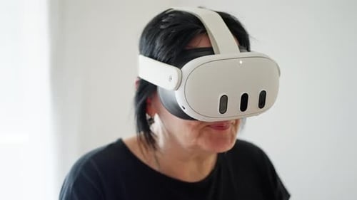 Woman Using Virtual Reality Headset in Home