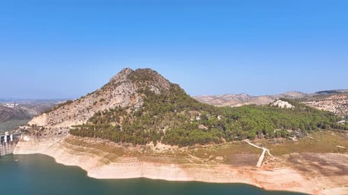Aerial across Andalusia's iconic La Camorra mountain and recreation area on stunning Summer day