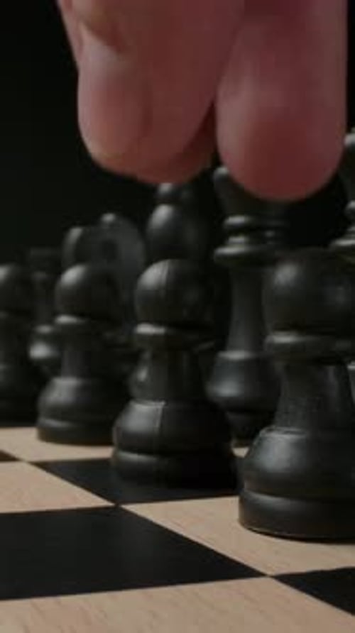 Vertical of The First Standard Move By Chess Black Pawn on Chess Board