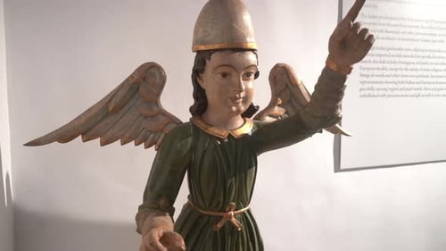 Statue of archangel Michael pointing his fingers at the sky. IN Christianity, he is the chief of all