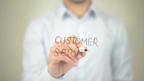 Man Writes Customer Service on a Clear Surface