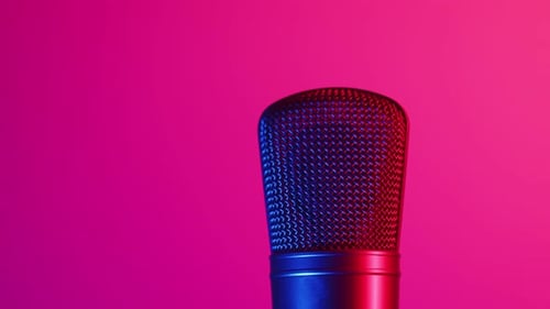 Closeup Concert Microphone on Stage in Audio Record Studio with Neon Light Professional Vocal