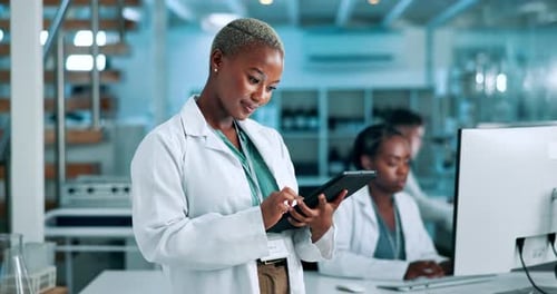 Female Scientist Using Tablet in Lab