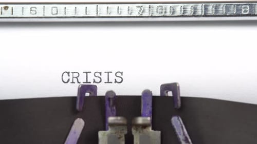 Typewriter Types the Word Crisis