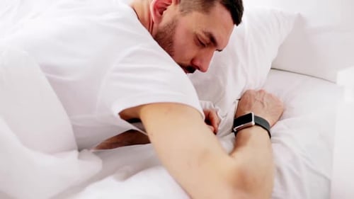 Man Lying in Bed, Feeling Unwell