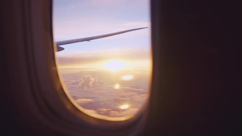 View of beautiful blue sky and sunset with cloudy outside an airplane.