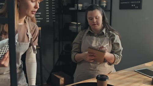 Women Working in Coffee Shop Taking Order