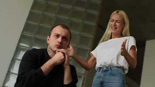 Closeup Lowangle View of Mad Emotional Wife Scolding Raising Voice Shouting and Gesturing with Hands