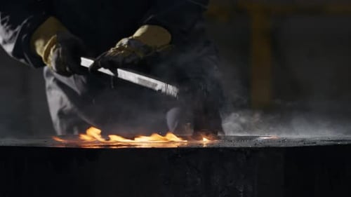 Metal Shaping with Flames in a Dark Factory