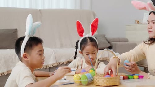 Family Paints Easter Eggs with Bunny Ears